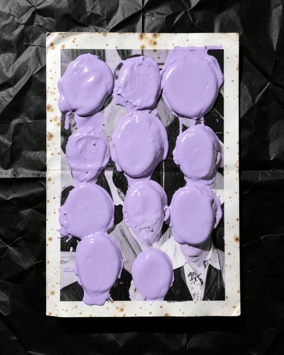 A collection of portraits where every face is covered with purple paint.
